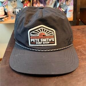 Legacy Black Trucker Hat with Green Logo Patch